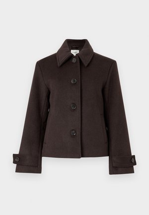 Barna gyapjúkabát, nyakkal, hat fekete gombbal és két oldalsó zsebbel. Hosszú ujjak jellemzik, gombos mandzsettával.