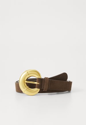 Brown suede belt with a large gold metal circular buckle, featuring a smooth texture and a single strap.