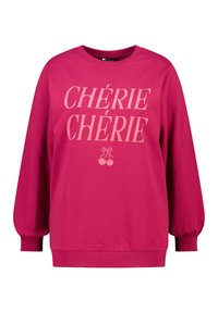 Sweat-shirt rose vif en coton, avec des manches surdimensionnées, des poignets côtelés, et un graphique à l'avant avec le texte "CHÉRIE CHÉRIE" et des cerises.