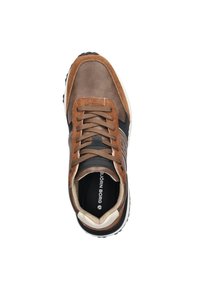 Brown suede and leather sneaker with black accents, round toe, flat lace closure, and white sole. Brand name visible on the insole.
