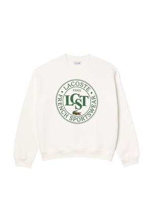 Witte sweatshirt met een ronde groene Lacoste-logo met de tekst "LACOSTE PARIS FRENCH SPORTSWEAR" en een krokodilafbeelding.
