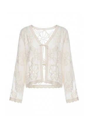 Transparenter cremefarbener Cardigan mit langen Ärmeln, floralem Spitzenmuster, geschwungenen Kanten und kleinem Binderverschluss vorne.
