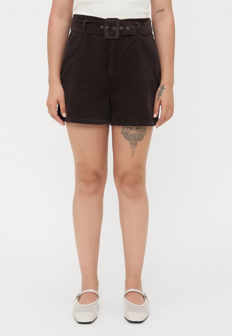 Brown corduroy shorts with a wide belt featuring a rectangular buckle and metal eyelets. Straight-cut legs ending mid-thigh.