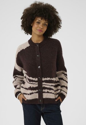 Brown and cream patterned cardigan with a round neckline, featuring a button front and textured knit fabric. Long sleeves and relaxed fit.