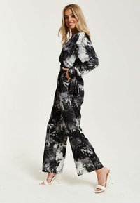 Liquorish MONO ABSTRACT PRINT WITH LONG SLEEVES - Jumpsuit - black