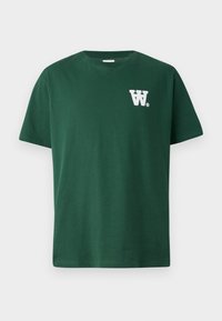 Green cotton t-shirt featuring a round neckline and short sleeves, with a white “W” logo on the left chest. Plain design, no patterns.