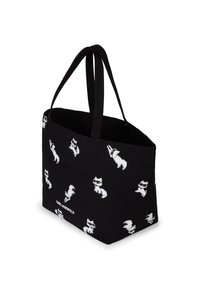 Czarna torba na ramię z białymi grafikami lisa, z materiału tekstylnego, z podwójnymi uchwytami i nadrukiem "KARL LAGERFELD" na dole.