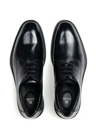 Scarpe eleganti in pelle nera con finitura liscia, punta rotonda, design con sei occhielli e lacci, e dettagli di cucitura sottili attorno alla suola.