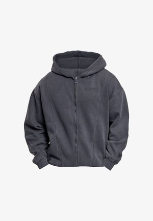 Sötétszürke cipzáros kapucnis pulóver puha anyagból, kapucnival, bordázott mandzsettákkal és egy diszkrét logóval az elején. Egyszerű dizájn és laza szabás.