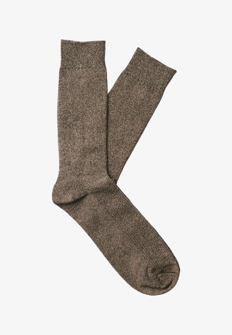 Chaussettes marron tricotées à hauteur de cheville, posées à plat, montrant la texture et les bords côtelés, conçues pour un usage quotidien.