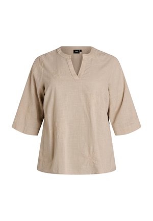 Beige Kurzarmbluse mit V-Ausschnitt, dezentem Blumenstickerei und strukturiertem Stoffmuster, auf einem schlichten Hintergrund präsentiert.