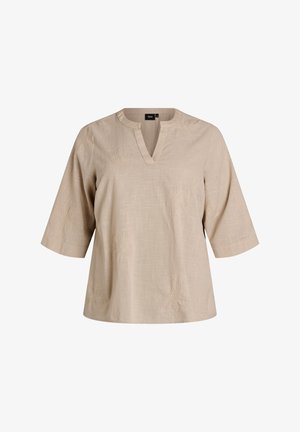 Béžová krátký rukáv halenka s výstřihem do V, jemnou květinovou výšivkou a texturovaným vzorem látky, zobrazena na jednobarevném pozadí.