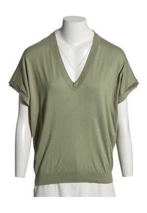 Top vert clair à manches courtes avec col en V et détails de poignets sur les manches, présenté sur un buste de mannequin blanc.