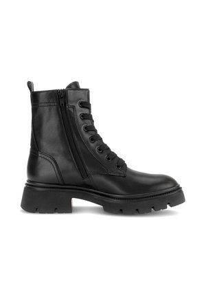 Black leather combat boot with thick rubber sole, side zipper, and lace-up front, shown from the outer side on a white background.