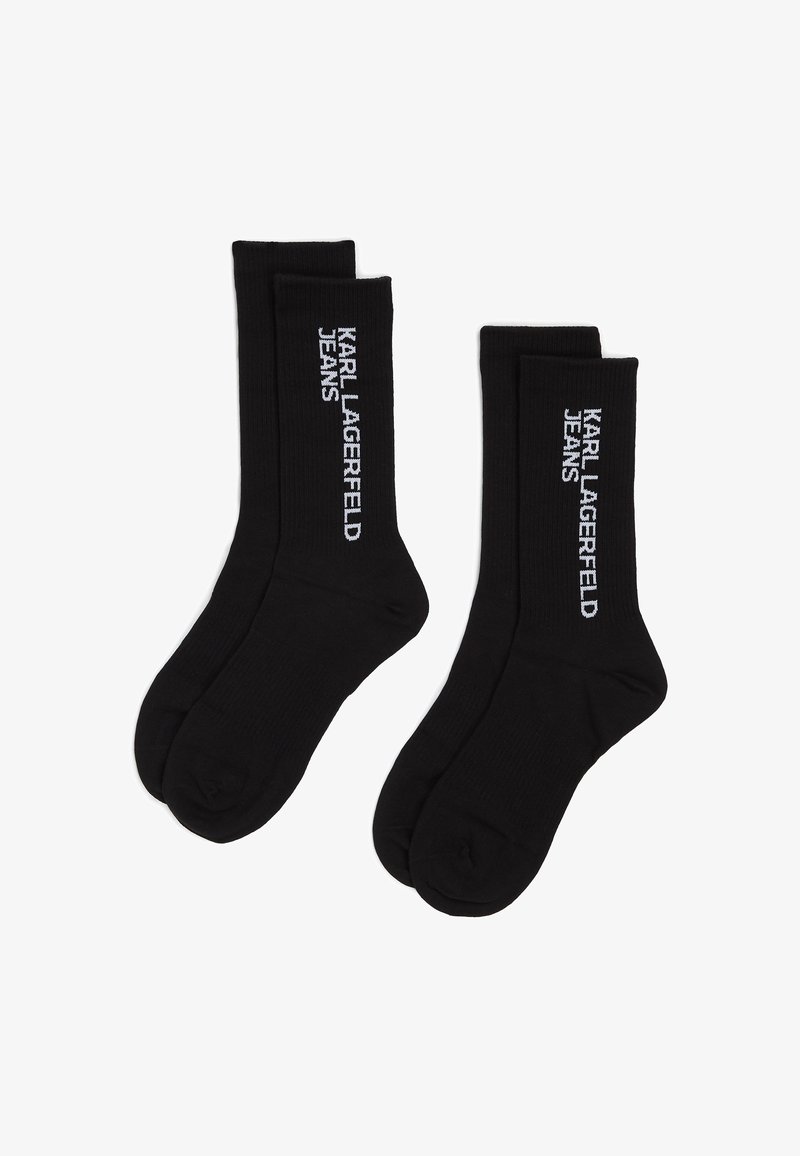 Svarta bomullssockor med ribbad textur och logotyp "KARL LAGERFELD JEANS" i vitt, placerad vertikalt längs sidan. Standard ankellängd.
