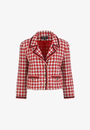 Giacca in tweed a quadretti rossi e bianchi con taglio sartoriale, rever a scialle, piping nero e bottoni dorati come dettagli. Lunghezza corta con due tasche.
