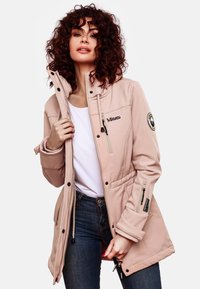 Light pink jacket with a zip front, adjustable hood, and drawstring waist. Features zipper pockets and logo accents. Smooth fabric texture.
