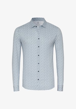 Long-sleeved shirt in white and navy with a geometric print, button-up front, and a structured collar. Soft fabric texture.