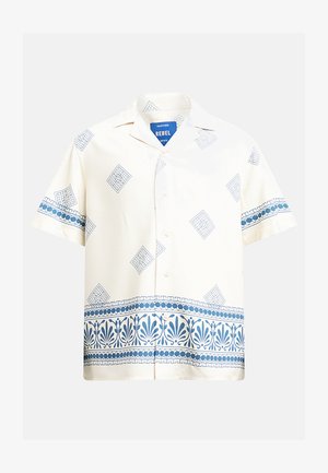 Kortermet skjorte med krage i kremfarge, med blå geometriske mønstre og en blomsterkant. Laget av lett stoff med en avslappet passform.
