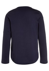 Navy long-sleeve T-shirt, soft cotton fabric, round neck, curved hem, and no visible fastenings. Smooth texture with minimal detailing.
