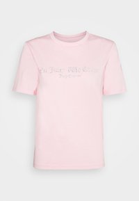 Růžové bavlněné tričko s krátkými rukávy a kulatým výstřihem, zdobené kamínky, které tvoří text na přední straně.