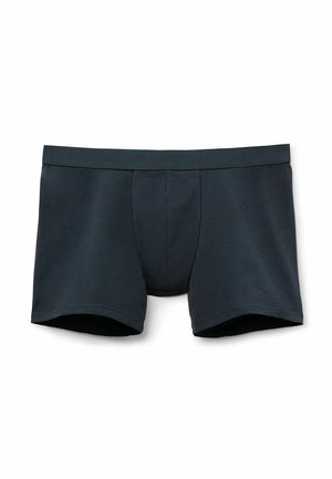 Boxer shorts de hombre en gris oscuro, fabricados con una tela suave, que presentan una cinturilla lisa y un corte clásico sin patrones ni acentos visibles.