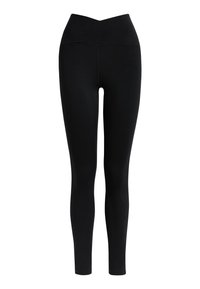 Leggings noirs avec une taille haute, croisée. Fabriqués en tissu lisse et extensible ; ajustés sur toute la jambe avec un design sans couture.