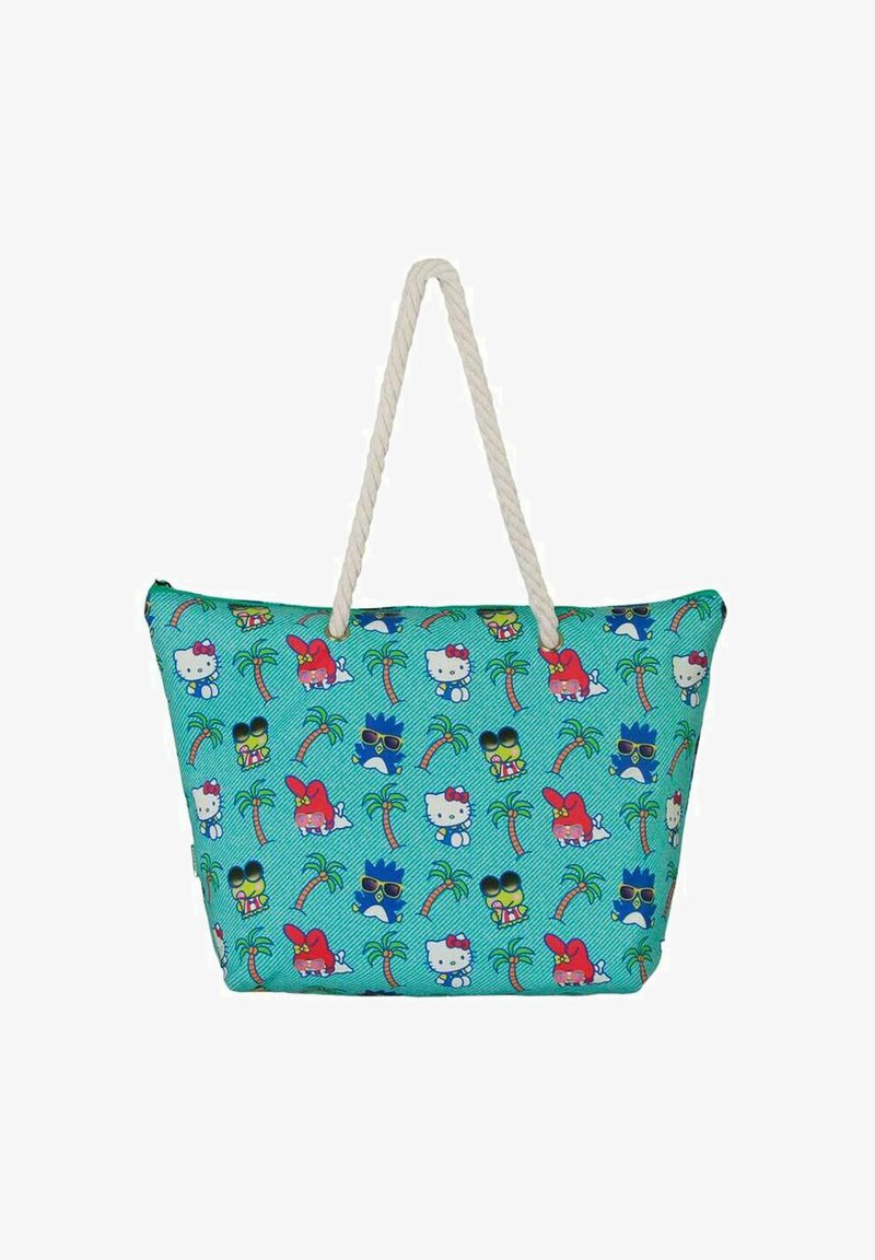 Bolso de tote con un fondo azul verdoso, que presenta un patrón repetido de animales de dibujos animados, palmeras y colores vibrantes. Con asas de cuerda.