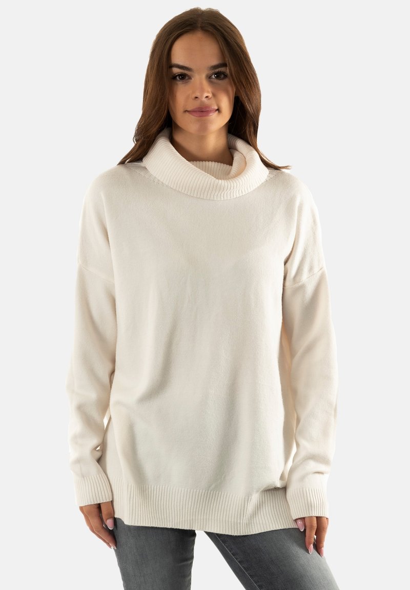 Maglione oversize crema con colletto a dolcevita a coste, spalle cadenti e polsini e orlo a coste. Texture morbida e vestibilità comoda.