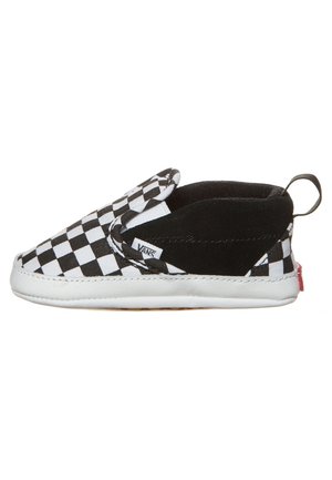 Dziecięce buty Vans slip-on w czarno-białą kratę, z białą podeszwą i czarną wyściółką, pokazane z boku.