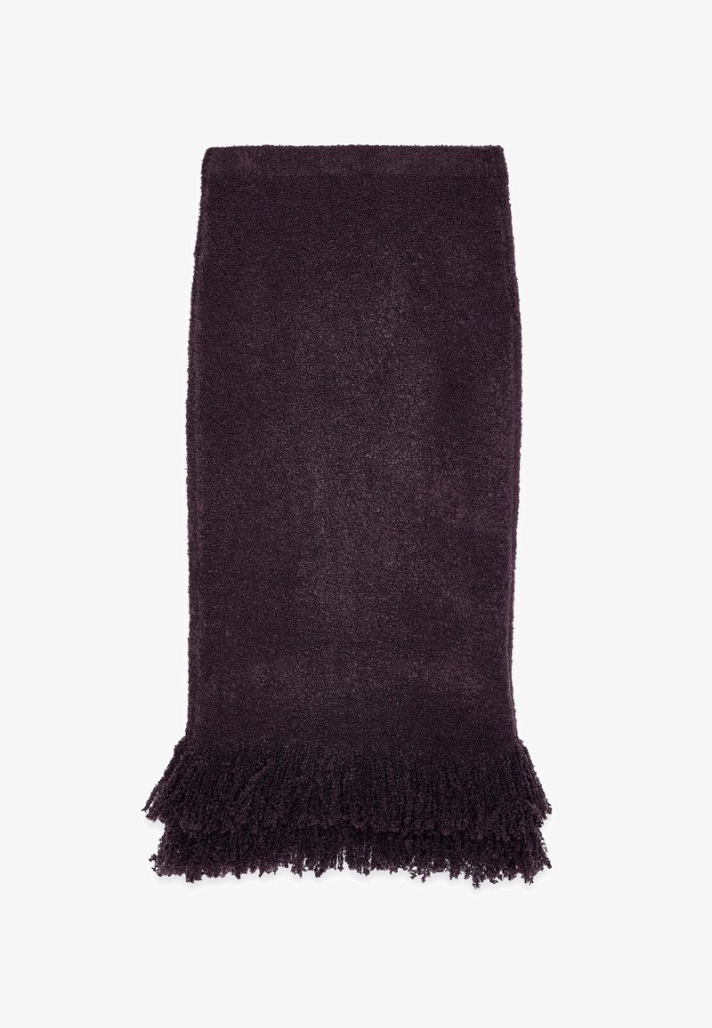 Lilla, tekstuuriga tekk, millel on pehme ja kohev viimistlus ning franjadega ääred. Ristkülikuline kuju, ühetooniline värv ja pehme pind.