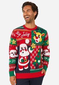 Megztas šventinis megztinis su Kalėdų Senelio ir elnių dizainais raudono, žalio ir balto spalvų derinyje. Apvalus kaklo iškirptė su ribotais rankogaliais ir apačia.