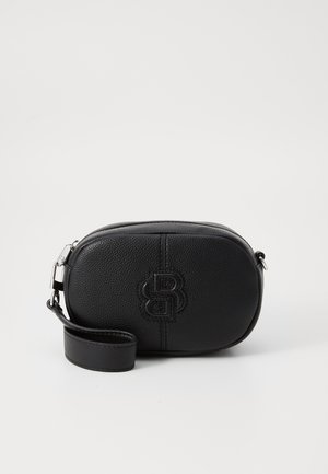 Black leather crossbody bag, oval shape, textured finish, featuring a stitched logo. Includes a matching wrist strap and zip closure.