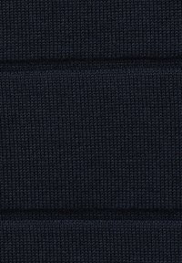 Dark navy knitted fabric with a textured rib pattern. The fabric appears dense with visible stitching lines and a soft, elastic texture.