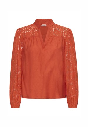 Oranž top, millel on pitsiline disain pikkadel varrukatel, V-kaelus ja kogutud sööt.