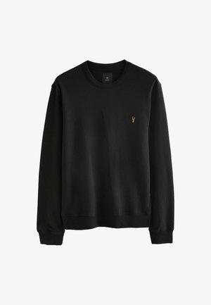 Crna dukserica od pamuka, s okruglim izrezom i dugim rukavima. Uključuje mali narandžasti logo jastoga na prsima.