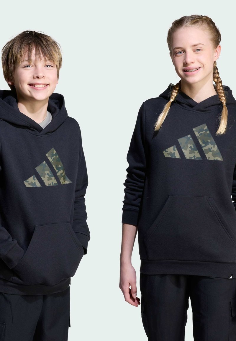Black hoodies featuring a large camouflage Adidas logo on the front. Soft fabric, kangaroo pockets, and ribbed cuffs. Suitable for casual wear.
