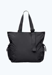 Svart nylonväska med två sidofickor och justerbara remmar, med en mjuk, texturerad yta och en rymlig rektangulär form.