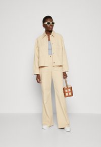 HUGO ANDERI - Jeansjacke - open beige