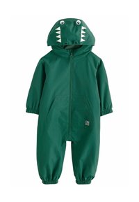 Salopette de pluie verte avec capuche sur le thème des dinosaures, présentant des dents et des yeux blancs. Comprend des poignets élastiques et deux poches frontales. Matériau imperméable.