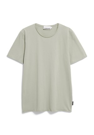 Hellgrünes Baumwoll-T-Shirt mit rundem Halsausschnitt und kurzen Ärmeln. Hat einen geraden Schnitt und ein kleines Markenlabel an der Seitenaht.