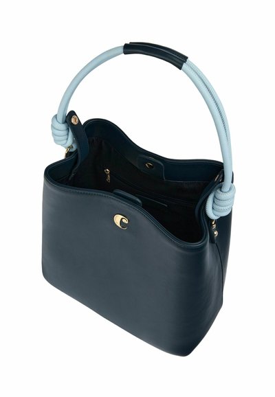 Navy leather handbag with a light blue woven handle, featuring gold hardware, an open top, and a spacious black interior with a zip pocket.