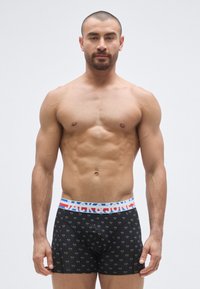 Mustat bokserialushousut, joissa monivärinen kukkakuvio, joustava vyötärönauha sinisin ja punaisin yksityiskohdin, sileä kangaspinta.