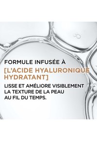 Texture de gel clair avec des bulles et une surface lisse, présentant un texte sur l'acide hyaluronique hydratant en métallisé doré et en caractères gras noirs.