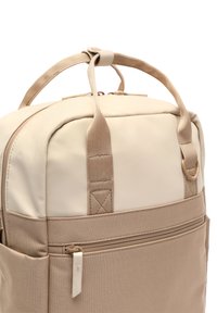 Beige backpack featuring a smooth, durable fabric with a structured shape. Includes dual top handles and a zippered front pocket for storage.