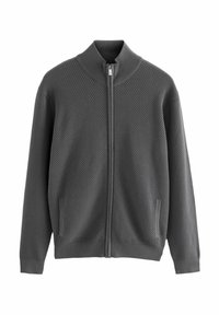 Grå zip-up jacka med texturerad mönster, hög krage och sidofickor. Ribbad fåll och ärmslut framhäver den strukturerade designen.