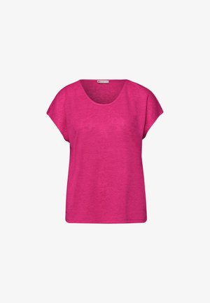 Jasnoróżowy damski top z krótkim rękawem, o okrągłym dekolcie i luźnym kroju, wykonany z miękkiego, teksturowanego materiału.