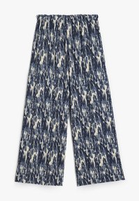 Pantaloni a gamba larga con una vita elastica. Tessuto testurizzato con un motivo astratto blu e bianco. Materiale morbido e leggero.