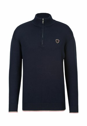 Marineblaues Strickpullover mit einem halben Reißverschlusskragen, gerippten Bündchen und Saum. Mit einem kleinen Wappenlogo in roten und weißen Akzenten am unteren Ende.