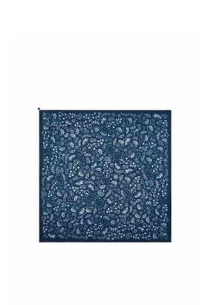 Dark blue square fabric with a dense pattern of various small white leaves and floral shapes evenly spread across the surface.